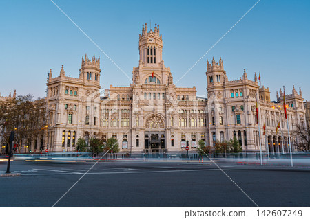 Cibeles Palace at golden hour with light trails from passing traffic in Madrid Cibeles Palace at golden hour with light trails from passing traffic in Madrid 142607249