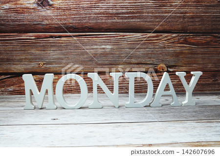 Monday alphabet letters on wooden background Monday alphabet letters on wooden background 142607696
