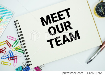 Meet Our Team text message written on notepad with stationery flat lay on white background Meet Our Team text message written on notepad with stationery flat lay on white background 142607764