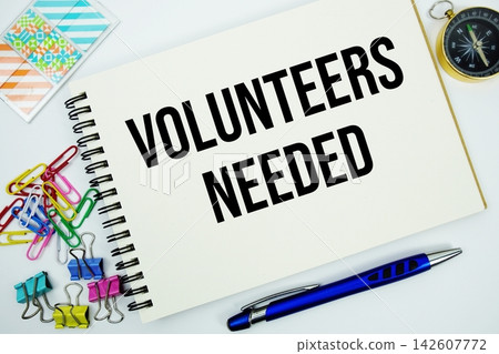 Volunteers Needed text message written on notepad with stationery flat lay on white background Volunteers Needed text message written on notepad with stationery flat lay on white background 142607772