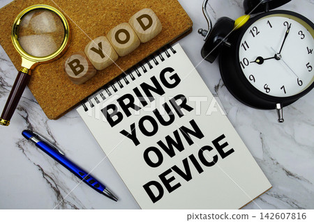 BYOD Bring Your Own Device text written on notepad with calculator and magnifying glass on marble background BYOD Bring Your Own Device text written on notepad with calculator and magnifying glass on marble background 142607816