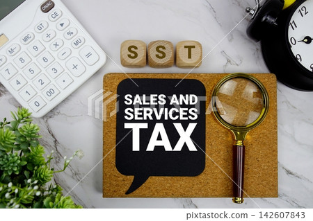 SST Sales and Services Tax text with calculator, magnifying glass and alarm clock on marble background SST Sales and Services Tax text with calculator, magnifying glass and alarm clock on marble background 142607843