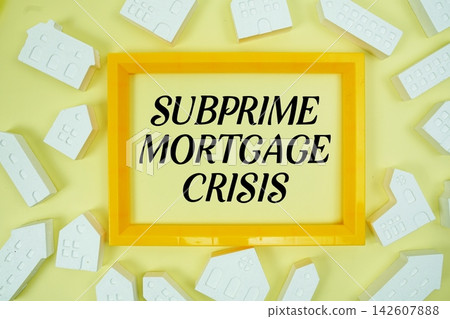 Subprime Mortgage Crisis text with house models on yellow background Subprime Mortgage Crisis text with house models on yellow background 142607888