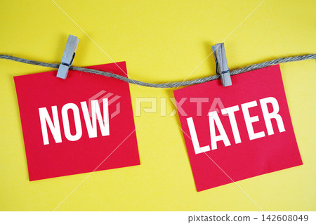 Now vs Later paper notes hanging on the rope with clothespins Now vs Later paper notes hanging on the rope with clothespins 142608049