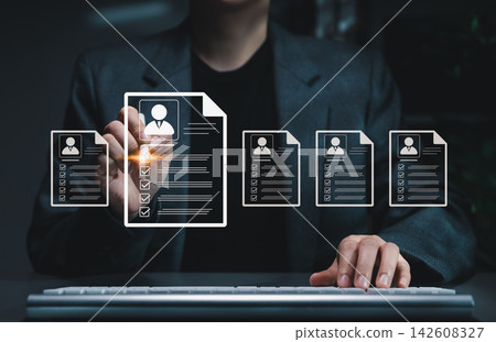 Digital Resume Screening by HR Professional. Human resource managers evaluate multiple resumes or CV online, modern recruitment and candidate selection processes. best employees for corporate business Digital Resume Screening by HR Professional. Human resource managers evaluate multiple resumes or CV online, modern recruitment and candidate selection processes. best employees for corporate business 142608327