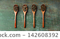 Assortment of Loose Leaf Teas in Wooden Spoons on Rustic Background 142608392