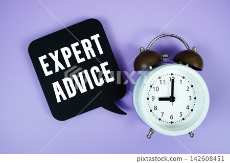 Expert Advice text on speech bubble with alarm clock on purple background Expert Advice text on speech bubble with alarm clock on purple background 142608451