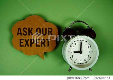 Ask Our Expert text on speech bubble with alarm clock on green background Ask Our Expert text on speech bubble with alarm clock on green background 142608461
