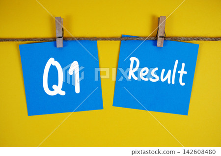 Q1 Result paper notes hanging on the rope with clothespins Q1 Result paper notes hanging on the rope with clothespins 142608480