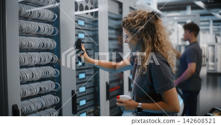 Data Center Maintenance Team Cleaning Server Room Hardware Data Center Maintenance Team Cleaning Server Room Hardware 142608521