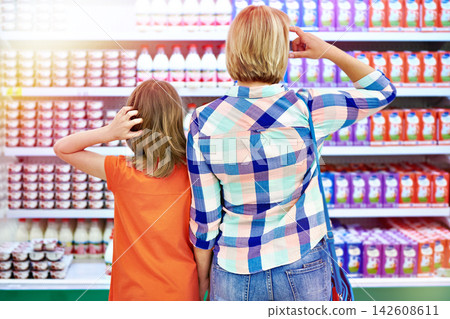 Mother and daughter in shop 142608611