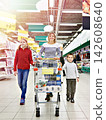 Happy women and children in store 142608640