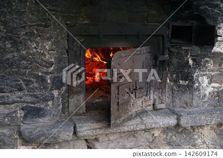 fire in a fireplace fire in a fireplace 142609174