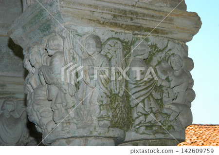 Romanesque capital carving depicting religious figures in Santillana del Mar Romanesque capital carving depicting religious figures in Santillana del Mar 142609759