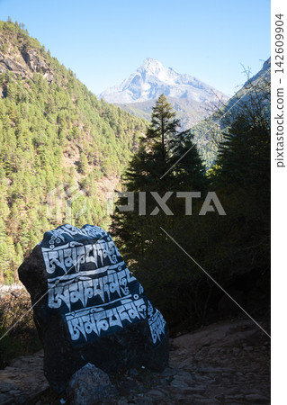 Rocks painted with prayers along EBC trek, Nepal Rocks painted with prayers along EBC trek, Nepal 142609904