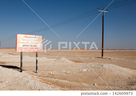 Road sign on desert track in the Rub al Khali, Empty Quarter, Oman Road sign on desert track in the Rub al Khali, Empty Quarter, Oman 142609973
