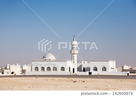 Village view and traditional buildings of Muqshin, Dhofar desert settlement in Oman Village view and traditional buildings of Muqshin, Dhofar desert settlement in Oman 142609978