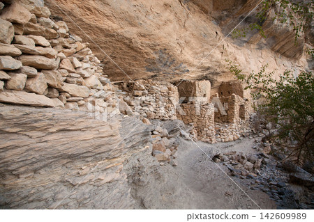 Panoramic hiking trail views of Jabal Shams canyon with abandoned village, Grand Canyon of Oman landscape Panoramic hiking trail views of Jabal Shams canyon with abandoned village, Grand Canyon of Oman landscape 142609989