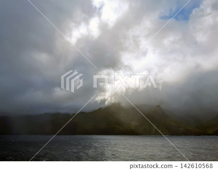 Misty Kauai Island Mountains Over Pacific Ocean in Hawaii Misty Kauai Island Mountains Over Pacific Ocean in Hawaii 142610568