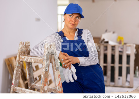 Portrait of smiling young woman repairer 142612066