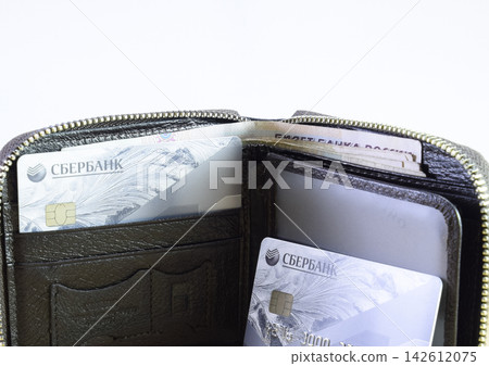 Brown leather wallet with credit and discount cards 142612075