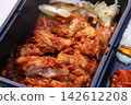 Korean Marinated Chicken with Side Dishes in Black Container 142612208