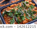 Fresh Basil Topped Pasta Dish in Black Tray 142612215