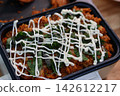 Spicy Korean Bibimbap Bowl with Creamy Drizzle 142612217