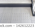 Tactile paving for the visually impaired located in front of stairs in public facilities 142612223