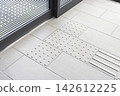 Tactile paving for the visually impaired located in front of stairs in public facilities 142612225