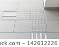 Tactile paving for the visually impaired located in front of stairs in public facilities 142612226