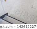 Tactile paving for the visually impaired located in front of stairs in public facilities 142612227