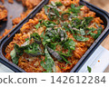 Baked Pasta Dish Topped with Fresh Basil Leaves 142612284