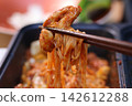 Spicy Korean Noodles with Chopsticks Close-Up 142612288