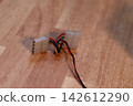 Electronic Connectors with Wires on Wooden Surface 142612290