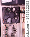 Computer Case Fan Close-Up Inside PC Chassis 142612292