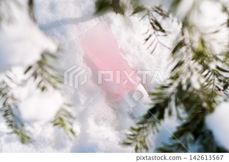 Skincare cosmetic tube in fresh winter snow 142613567