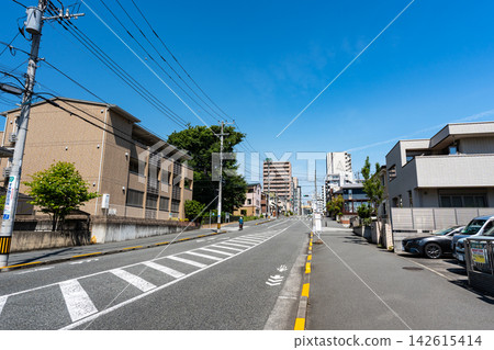 A road extending southeast from Toyoda Station on the Chuo Main Line, going uphill. Toyoda, Hino City, Tokyo. A road extending southeast from Toyoda Station on the Chuo Main Line, going uphill. Toyoda, Hino City, Tokyo. 142615414