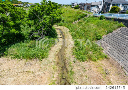 View of the small stream near Asakawa from Ichibanbashi Bridge, Minamidaira, Hino City, Tokyo. View of the small stream near Asakawa from Ichibanbashi Bridge, Minamidaira, Hino City, Tokyo. 142615545