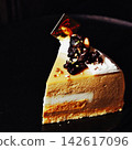 A fluffy, melt-in-your-mouth treat cake against a black background. 142617096