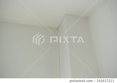 crack of pole on white wall from earthquake, construction industry crack of pole on white wall from earthquake, construction industry 142617221