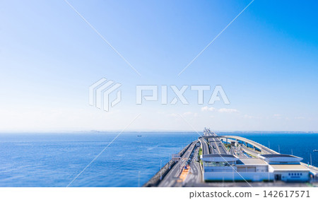 aerial view of umihotaru parking area and tokyo bay aqua line bridge in chiba japan with copy space, tilt shift miniature effect 142617571