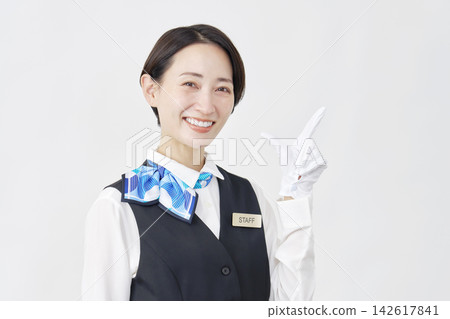 Female staff member, receptionist/bus guide, check sign, white background. Female staff member, receptionist/bus guide, check sign, white background. 142617841