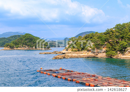 Touring the islands of Kujukushima by sightseeing boat. Touring the islands of Kujukushima by sightseeing boat. 142618627
