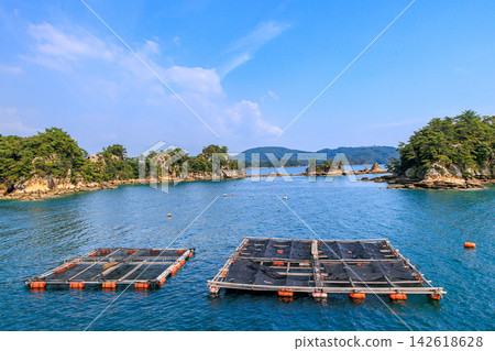 Touring the islands of Kujukushima by sightseeing boat. Touring the islands of Kujukushima by sightseeing boat. 142618628