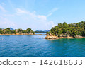 Touring the islands of Kujukushima by sightseeing boat. Touring the islands of Kujukushima by sightseeing boat. 142618633