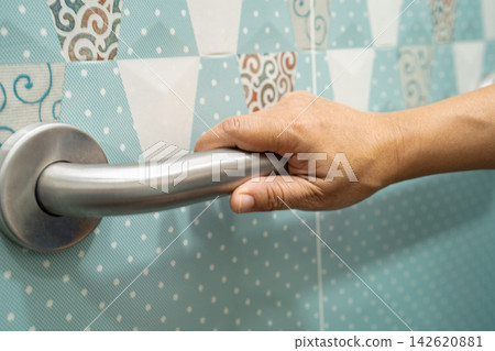 Asian elderly woman use toilet bathroom handle security, healthy strong medical. 142620881