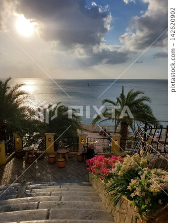 American Village in Chatan Town, Okinawa: Palm trees and cobblestone slopes. American Village in Chatan Town, Okinawa: Palm trees and cobblestone slopes. 142620902