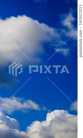 large white cloud in top part of blue sky large white cloud in top part of blue sky 142621011