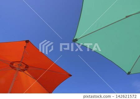 Umbrellas in the blue sky Umbrellas in the blue sky 142621572